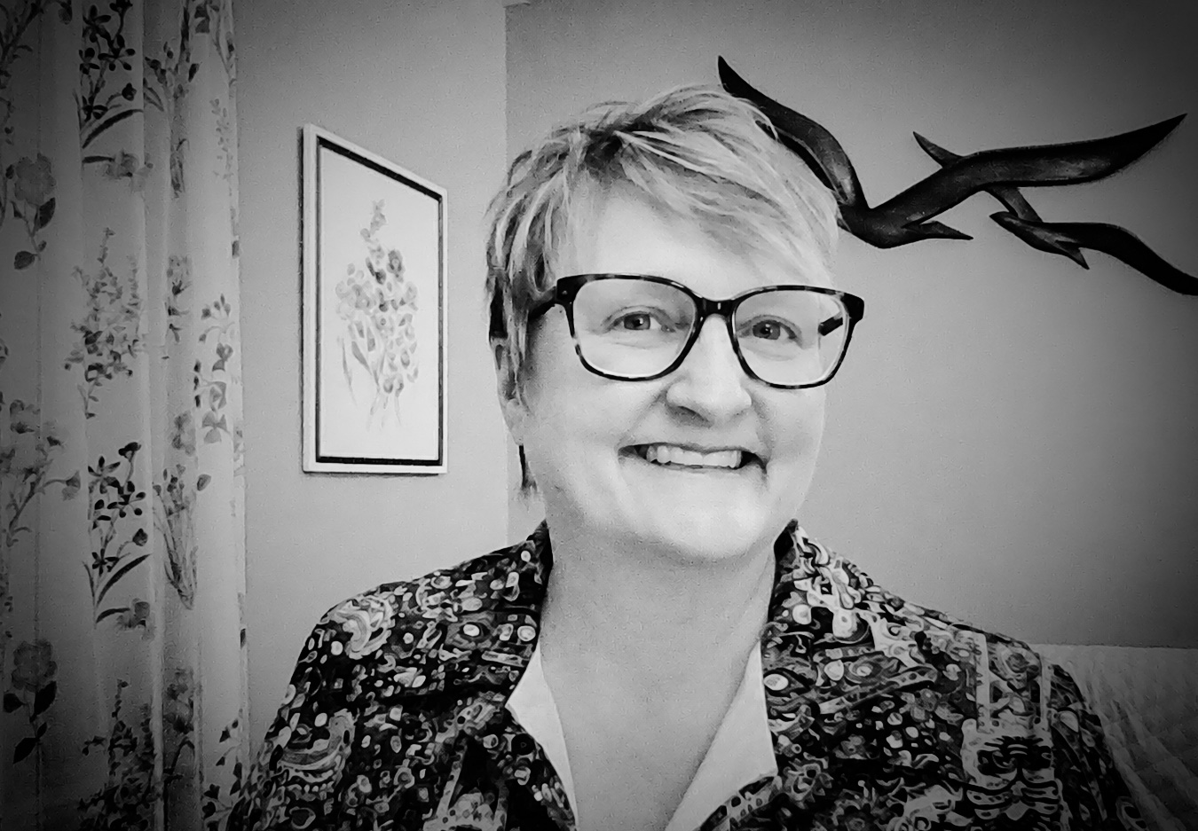 Dr. Julie States smiling in a black-and-white portrait